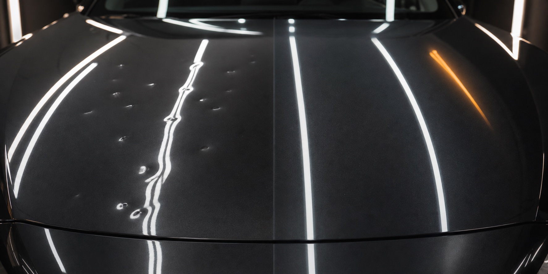 Vehicle hood inspected under reflective PDR lights